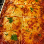 baked lasagna with melted cheese and parsley 1